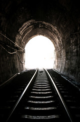Fototapeta na wymiar Light at the end of railroad tunnel