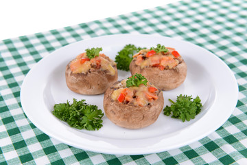 Stuffed mushrooms on plate on table close-up