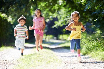 Three Asian Children Enjoying Walk In Countryside