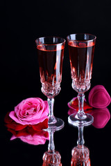 Composition with pink  wine in glasses and  roses