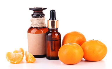 Tangerine essential oil and tangerines, isolated on white