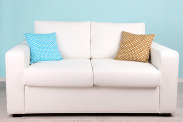 White sofa in room on blue background