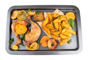 Homemade roasted chicken drumsticks with fried potatoes and