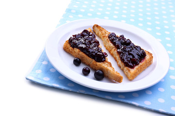 Delicious toast with jam on plate isolated on white