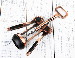 Corkscrew on wooden background