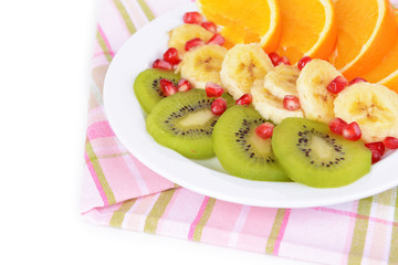 Sweet fresh fruits on plate on table close-up