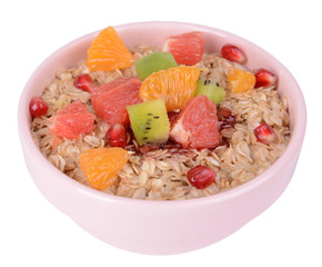 Delicious oatmeal with fruit in bowl isolated on white