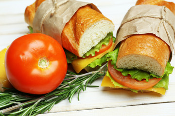 Fresh and tasty sandwich on wooden background