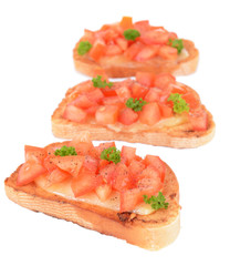 Delicious bruschetta with tomatoes isolated on white