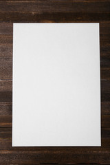 Paper on wooden background