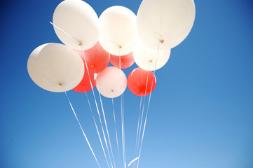 Bunch of white and red balloons