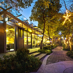 Illuminated restaurant with long footpath
