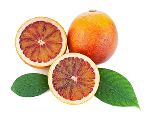 Blood oranges with cut and green leaves isolated on white backgr