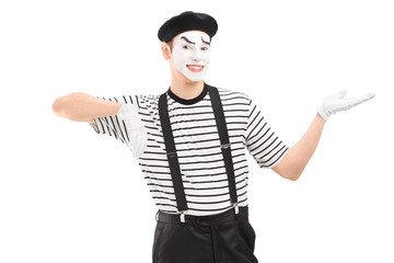 Male mime artist gesturing with hand