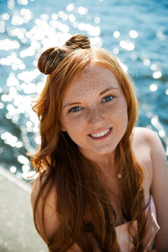 Beautiful young girl on river.