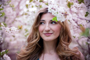 Beautiful young woman with flowers.