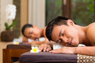 Indonesian couple having wellness massage © Kzenon