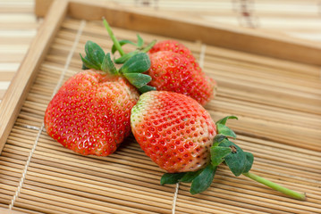 Fresh strawberries on wooden background