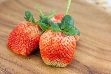 Fresh strawberries on wooden background