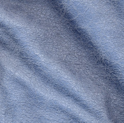 Fototapeta na wymiar background of blue crumpled leather
