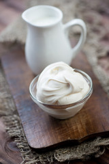 Sour cream, close-up, vertical shot