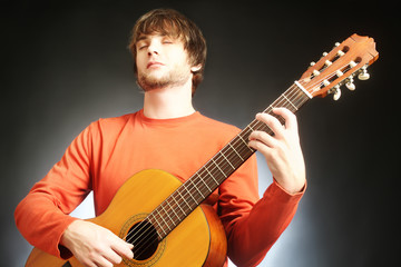 Obraz na płótnie Canvas Guitar player Acoustic guitarist