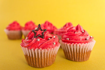 Group of cupcakes on yellow background