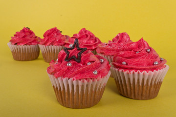 Group of cupcakes on yellow background