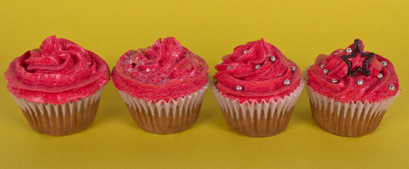 Group of cupcakes on yellow background