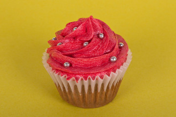 Cupcake on yellow background