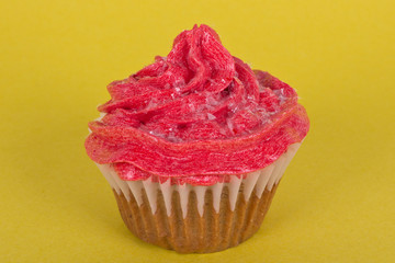 Cupcake on yellow background