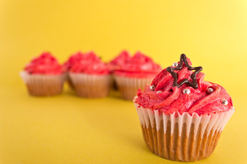 Group of cupcakes on yellow background