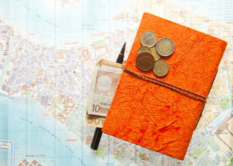 Travel Arrangement of Euro money, Map and notepad diary
