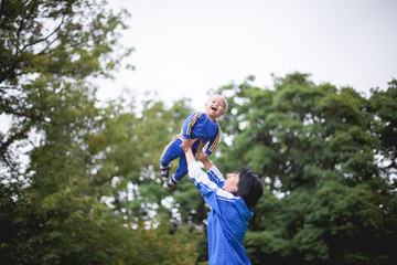 Mom throws his son and they in tracksuits