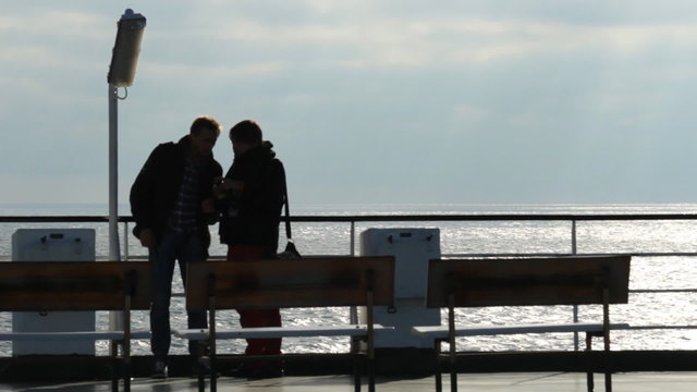 passengers on the deck of the ferry