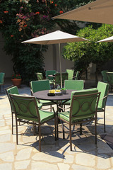Iron tables and chairs in beautiful patio