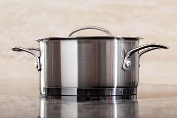 One new metal pot on kitchen top © Photographee.eu