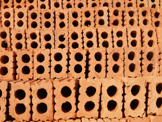 roll of red orange soil bricks for construction
