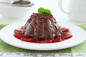 Chocolate panna cotta with strawberries and coffee.