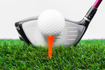 Close up of golf ball and tee with the driver