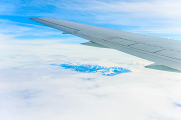 view of the wing of an airplane through the window