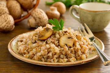 Buckwheat porridge with mushrooms on plate