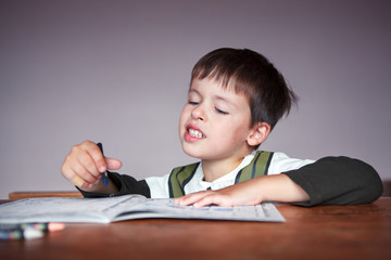 Young boy doing his homework at home