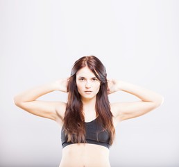 Fototapeta premium Beautiful young athletic woman, exercising