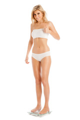 Obraz premium Thumbs Up Woman Standing on Bathroom Scales.