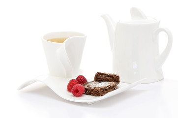 Tea with brownies and raspberries