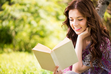 Fototapeta premium Beautiful Girl reading book in the park.