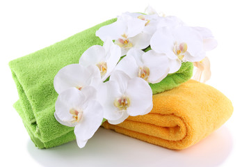 Obraz na płótnie Canvas Colorful towels and flowers, isolated on white
