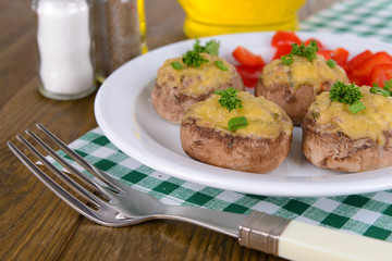 Stuffed mushrooms on plate on table close-up