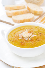Cream soup of yellow lentils with vegetables, close-up